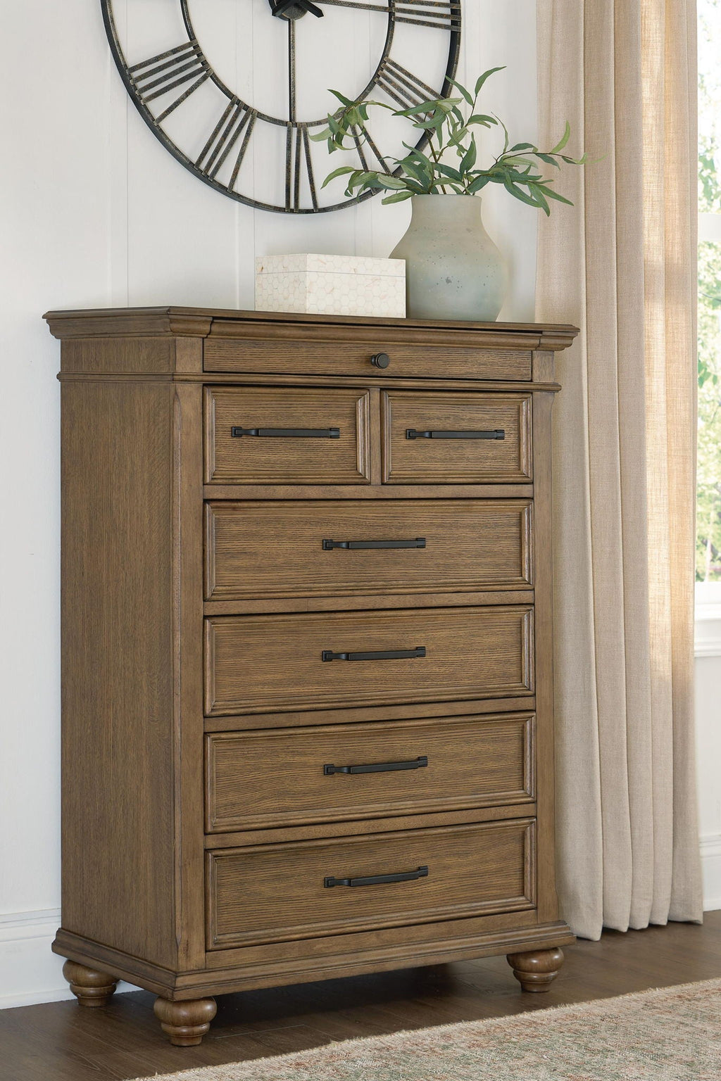 Karallin - Seven Drawer Chest - Medium Brown - Stylish Home Furniture