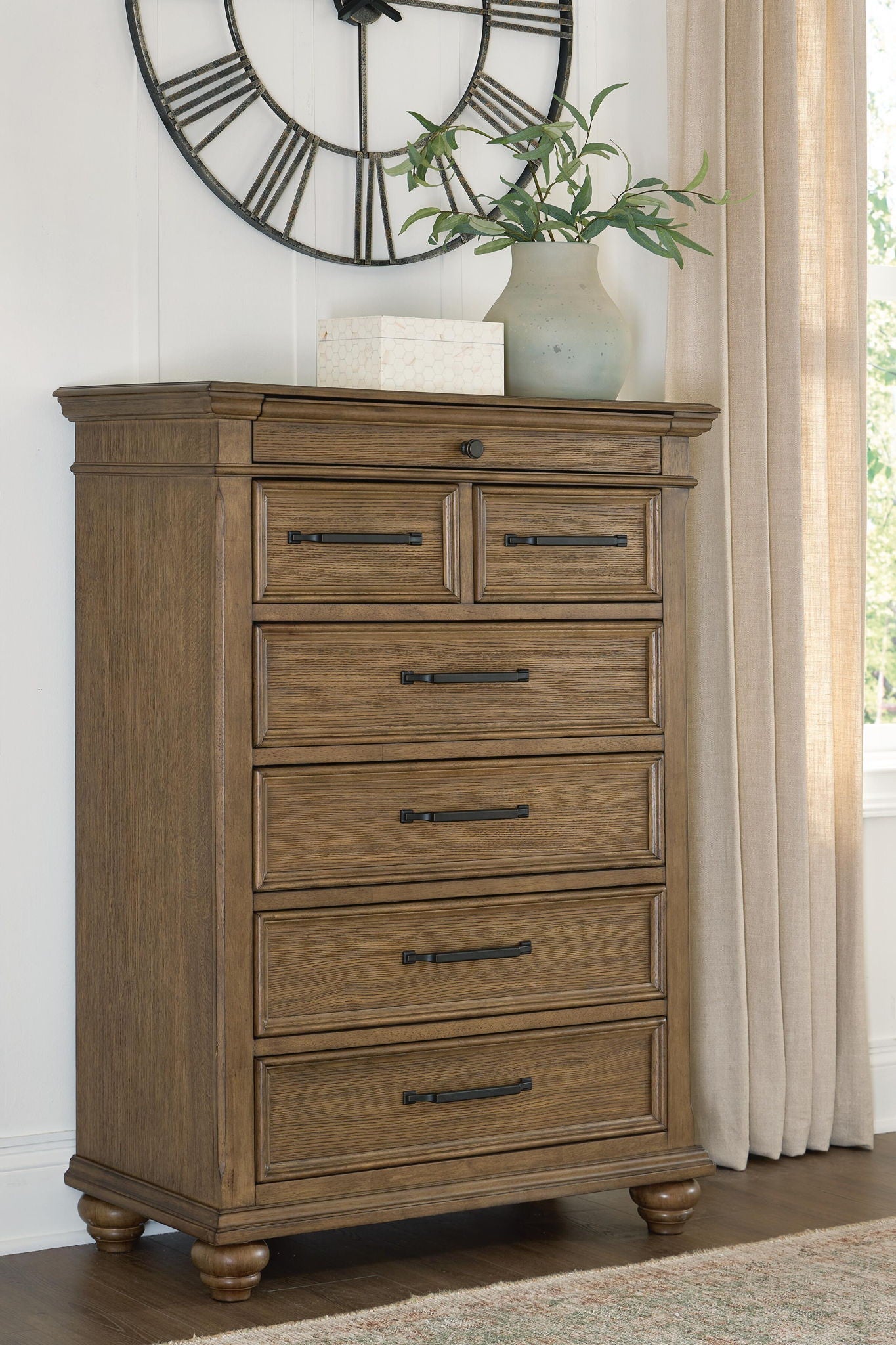 Karallin - Seven Drawer Chest - Medium Brown - Stylish Home Furniture